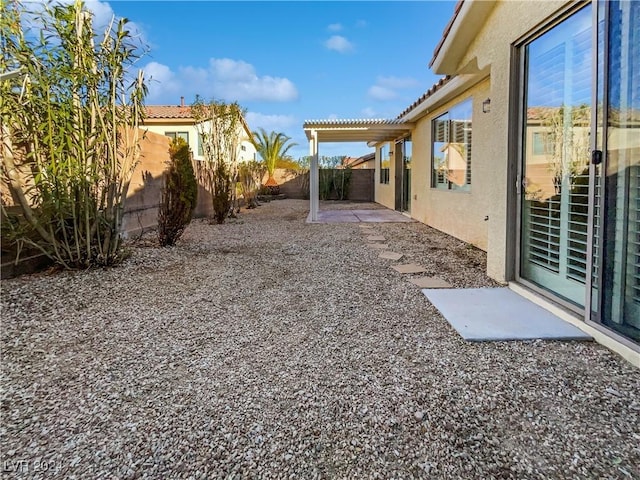 view of yard featuring a pergola and a patio area