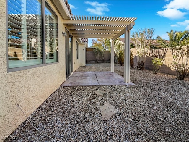 view of patio featuring a pergola