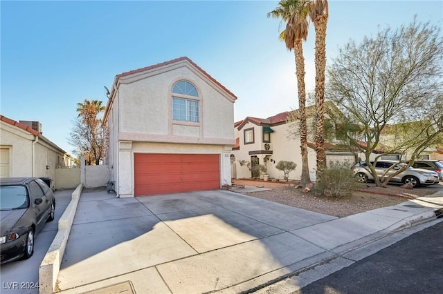 view of front of property with a garage