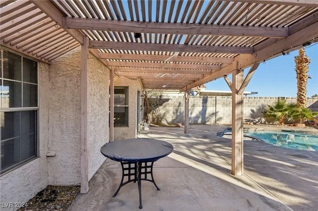 view of patio / terrace with a pergola and a fenced in pool