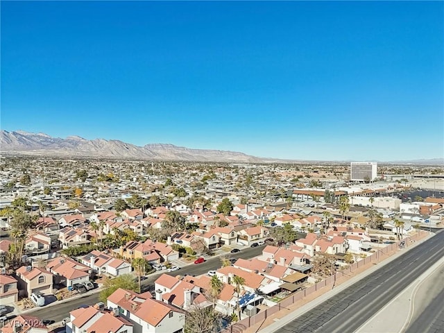 birds eye view of property featuring a mountain view