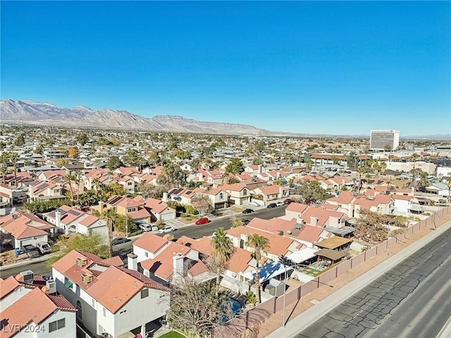 birds eye view of property with a mountain view