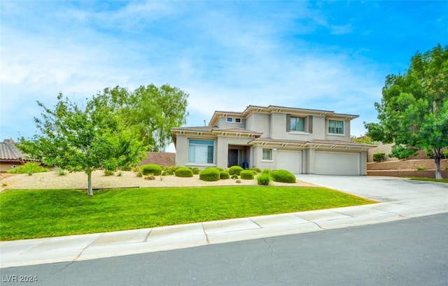 view of front of property with a front lawn and a garage