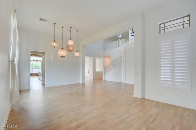 spare room featuring ceiling fan and light hardwood / wood-style floors