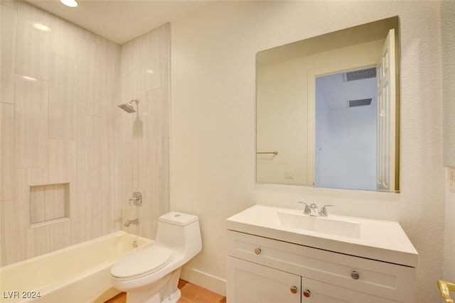 full bathroom featuring tiled shower / bath combo, toilet, and vanity