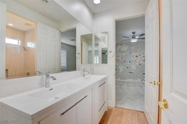 bathroom with ceiling fan, hardwood / wood-style floors, and vanity