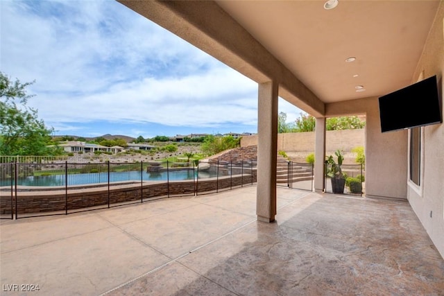 view of patio featuring a water view