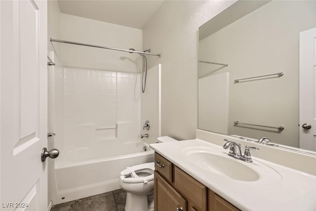 full bathroom with washtub / shower combination, vanity, tile patterned flooring, and toilet