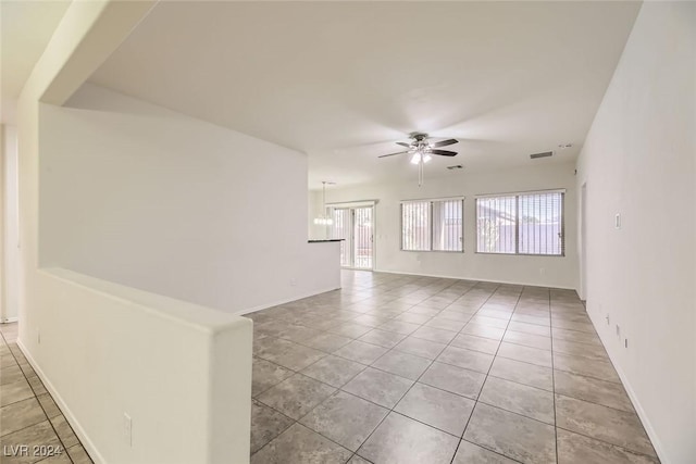 spare room with light tile patterned floors and ceiling fan