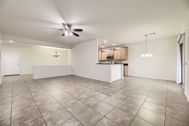 unfurnished living room with light tile patterned floors and ceiling fan with notable chandelier