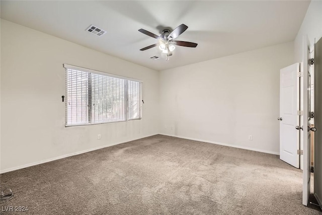 carpeted empty room with ceiling fan