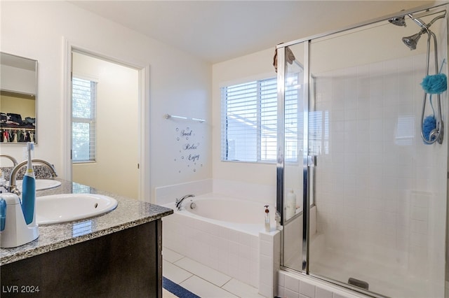 bathroom featuring vanity and independent shower and bath