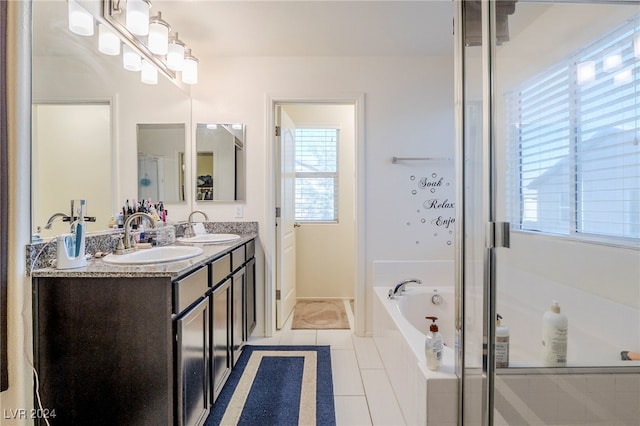 bathroom featuring tile patterned flooring, vanity, and independent shower and bath