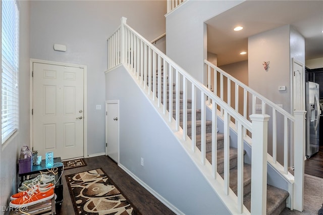 stairs featuring wood-type flooring