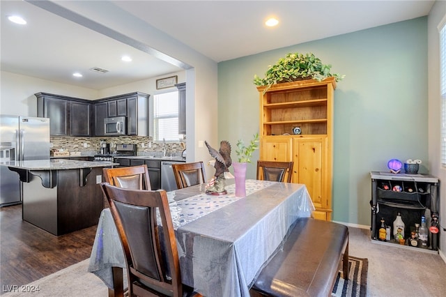 dining space featuring dark hardwood / wood-style floors