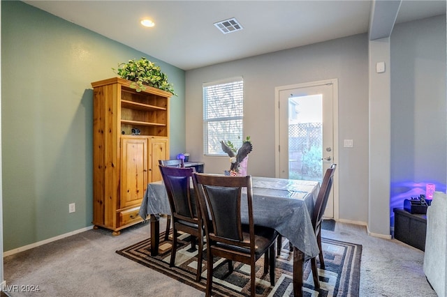 view of carpeted dining area