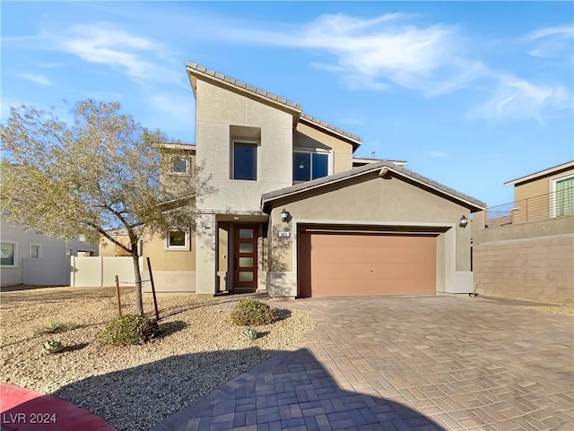 view of front of property with a garage