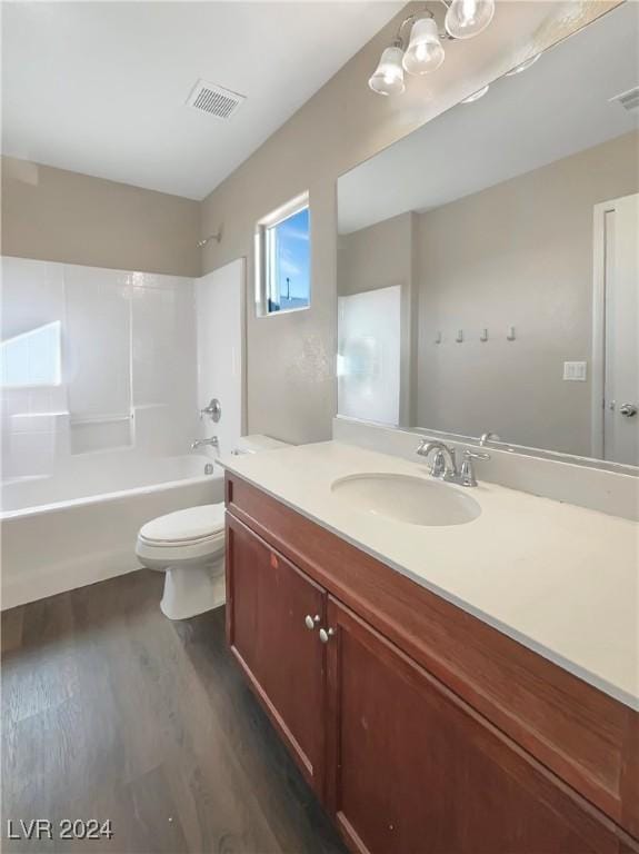 full bathroom with toilet, vanity, tub / shower combination, and hardwood / wood-style flooring