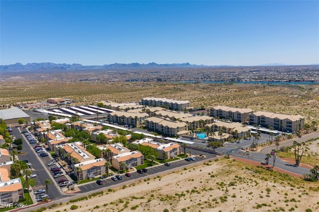 birds eye view of property with a mountain view