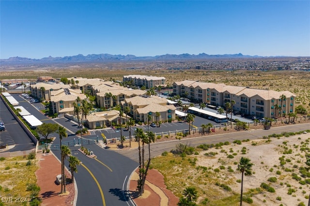 birds eye view of property with a mountain view