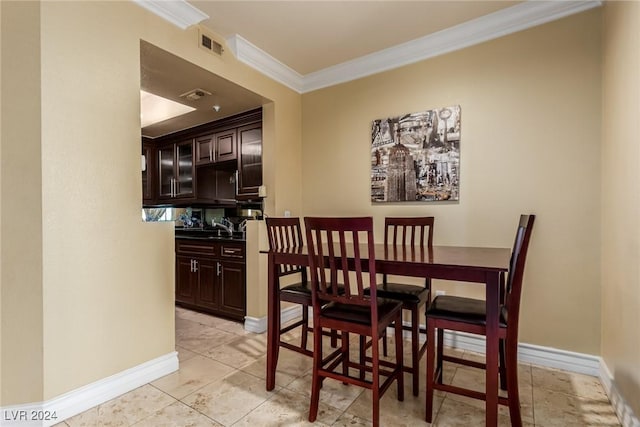 dining area featuring ornamental molding