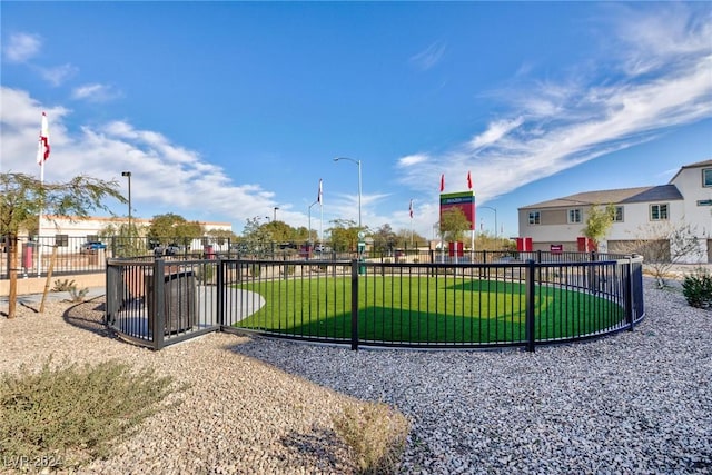 view of home's community with a yard