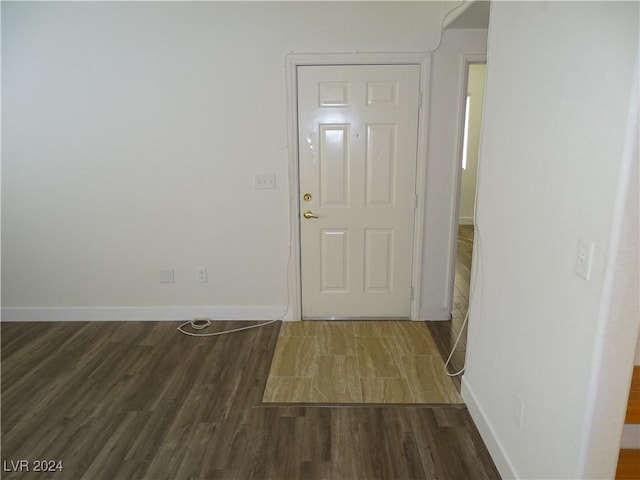 entryway with dark wood-type flooring