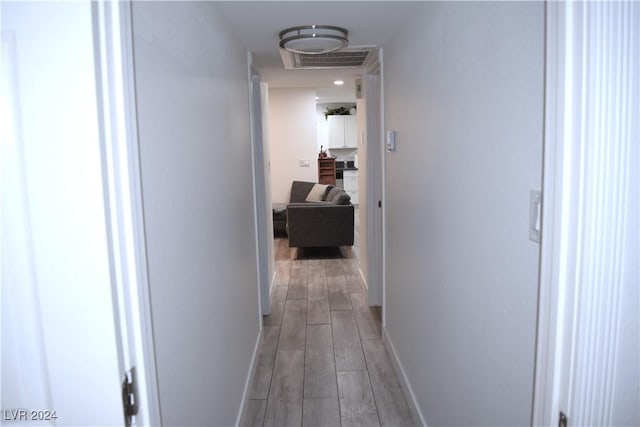 hallway featuring light hardwood / wood-style flooring