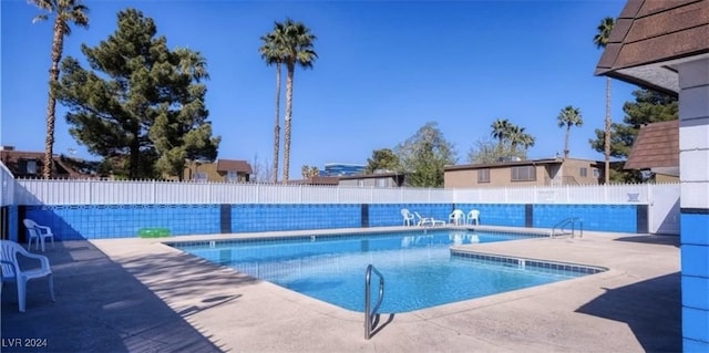 view of pool featuring a patio area