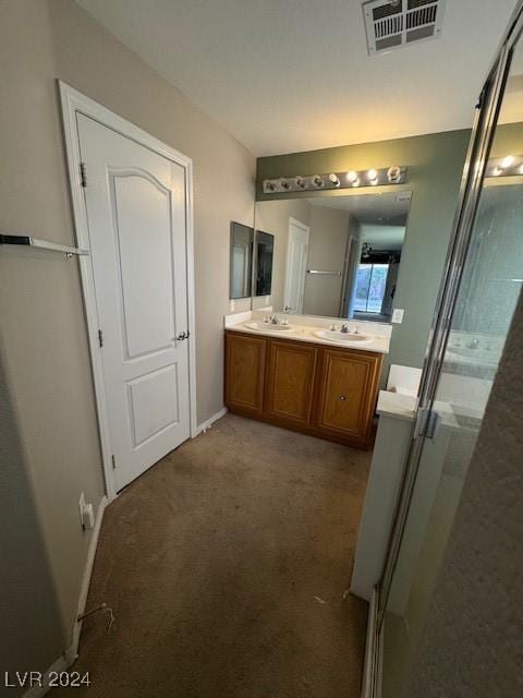 bathroom with vanity and an enclosed shower