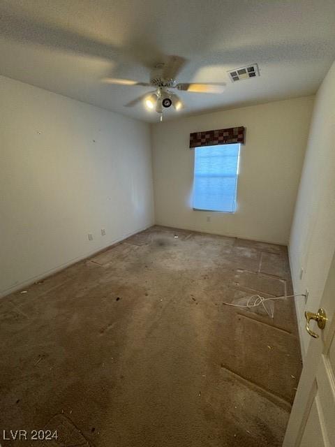 spare room with ceiling fan