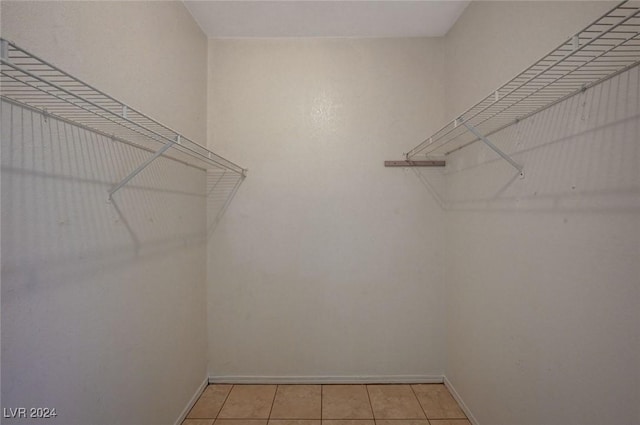 walk in closet featuring light tile patterned floors