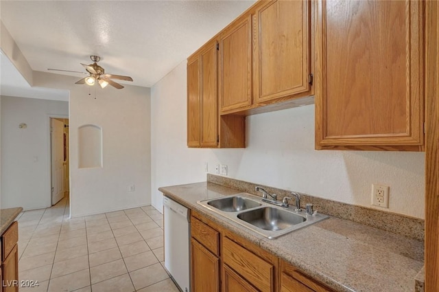 kitchen featuring white dishwasher, ceiling fan, light tile patterned flooring, and sink