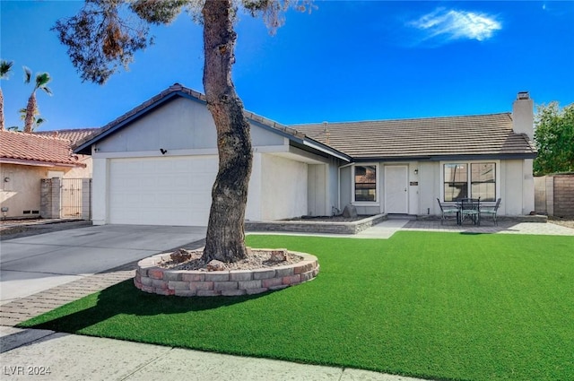 ranch-style home with a patio area, a garage, and a front yard