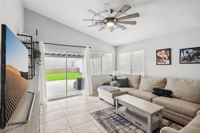 tiled living room featuring ceiling fan and lofted ceiling