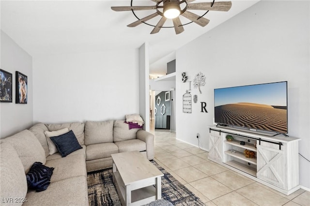 living room with ceiling fan and light tile patterned floors