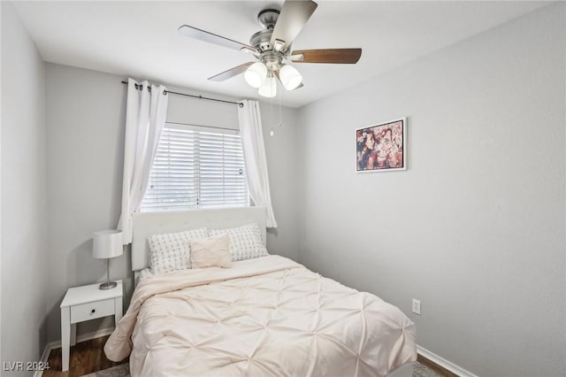 bedroom featuring hardwood / wood-style flooring and ceiling fan