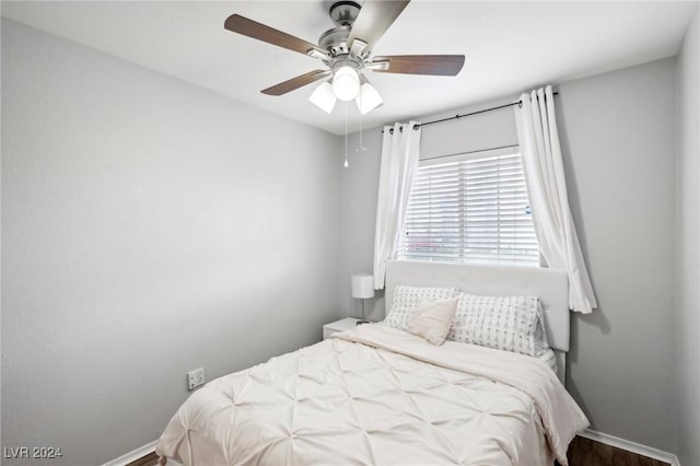 bedroom featuring ceiling fan and hardwood / wood-style flooring