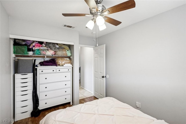 bedroom with ceiling fan and hardwood / wood-style floors