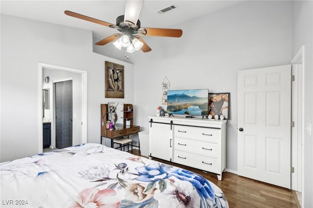 bedroom with dark hardwood / wood-style floors and ceiling fan