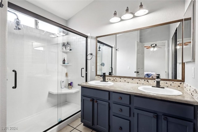 bathroom with tile patterned floors, ceiling fan, vanity, and a shower with shower door