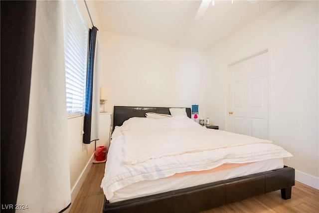 bedroom featuring hardwood / wood-style flooring and ceiling fan