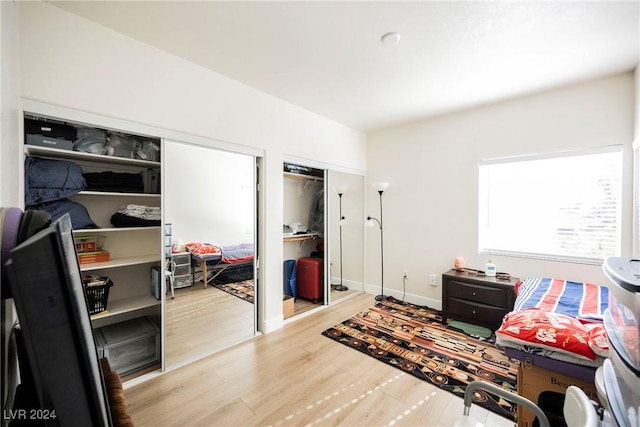 bedroom with hardwood / wood-style floors