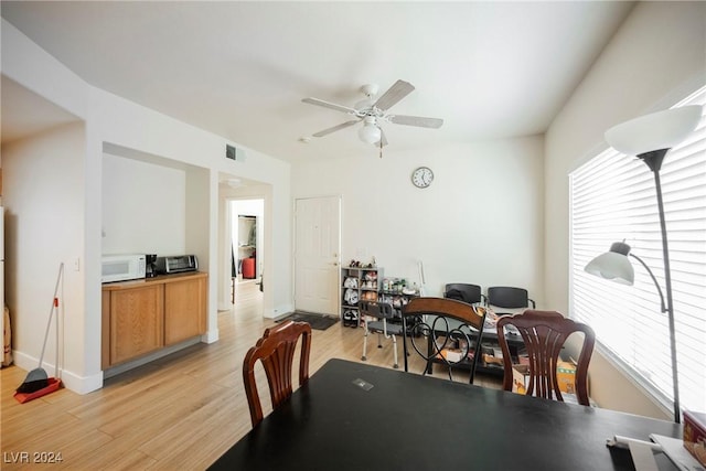 dining area featuring ceiling fan and light hardwood / wood-style floors