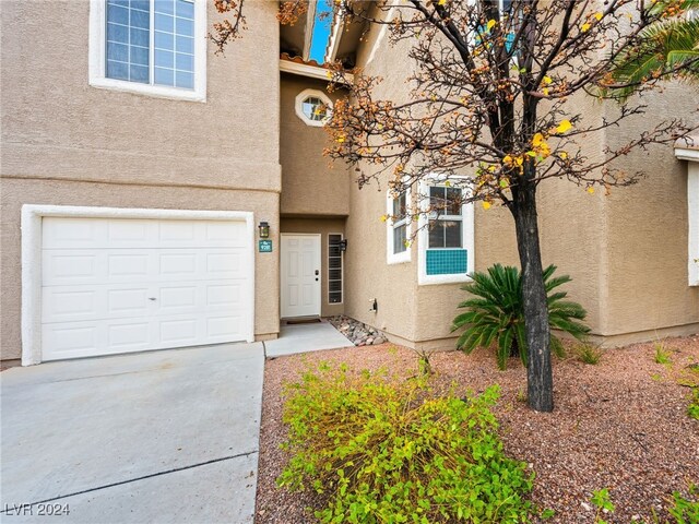 property entrance with a garage