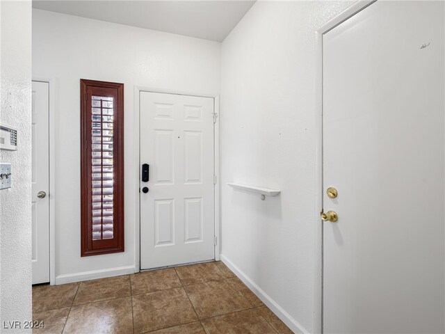 foyer entrance with tile patterned floors