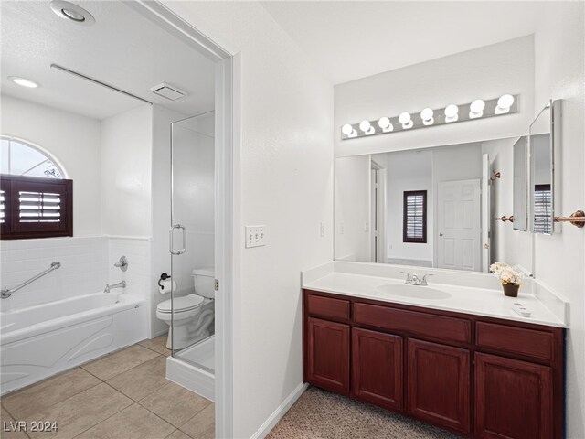 full bathroom with tile patterned floors, vanity, toilet, and plus walk in shower