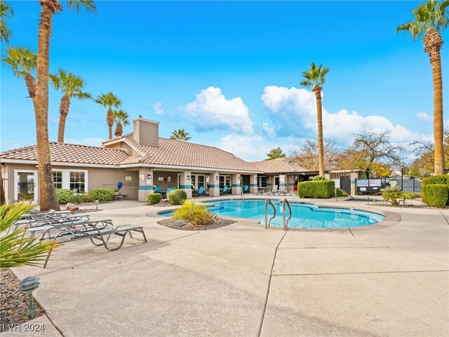 view of swimming pool with a patio