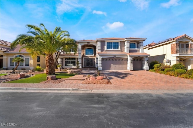 mediterranean / spanish house with a garage