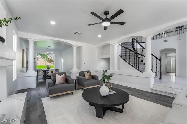 living room with ceiling fan and wood-type flooring